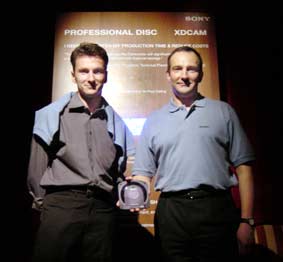 Olivier Bovis and Alain Pecot holding Sony's new optical XDCAM disc