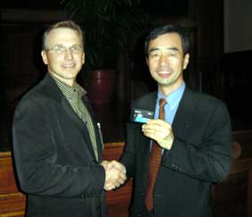 David Krall, CEO, Avid shaking hands with Yoshihiko Yamada, vp Panasonic AVC Network.